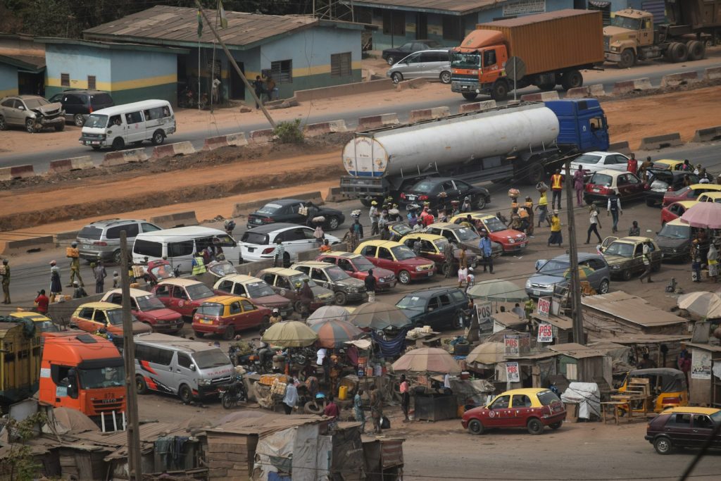 a parking lot full of cars and trucks