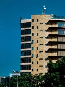 A tall building with a sign on top of it/document certification