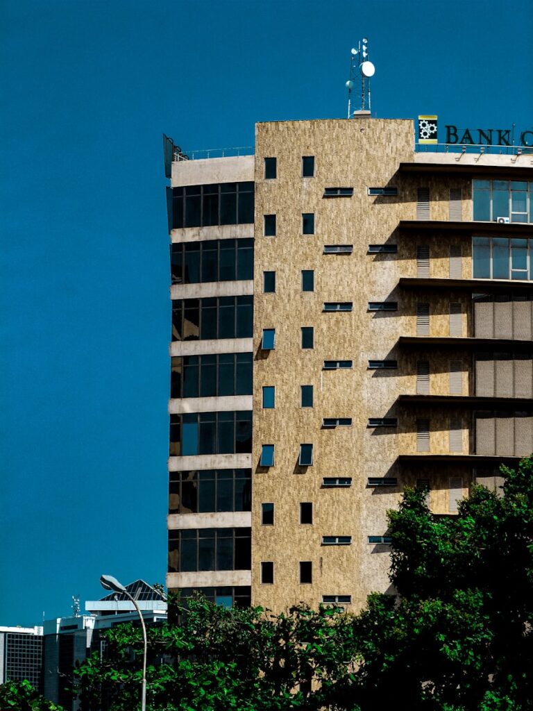 A tall building with a sign on top of it/document certification