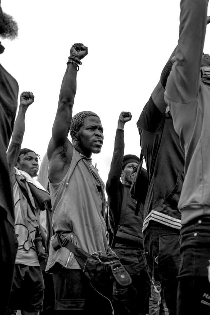 grayscale photo of man in black long sleeve shirt/NGO